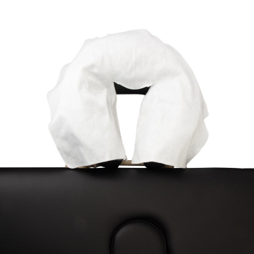 Disposable white head rest cover placed on black chair face cradle pack of 100