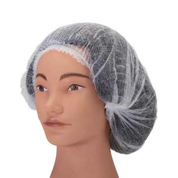 Female mannequin wearing a white disposable head bonnet for hygiene.
