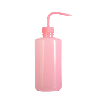 Pink plastic rinse and wash squeeze bottle with angled nozzle.