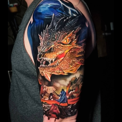 A colour realism tattoo by Dean Gunther showing Bilbo holding Sting up to Smaug the Dragon.