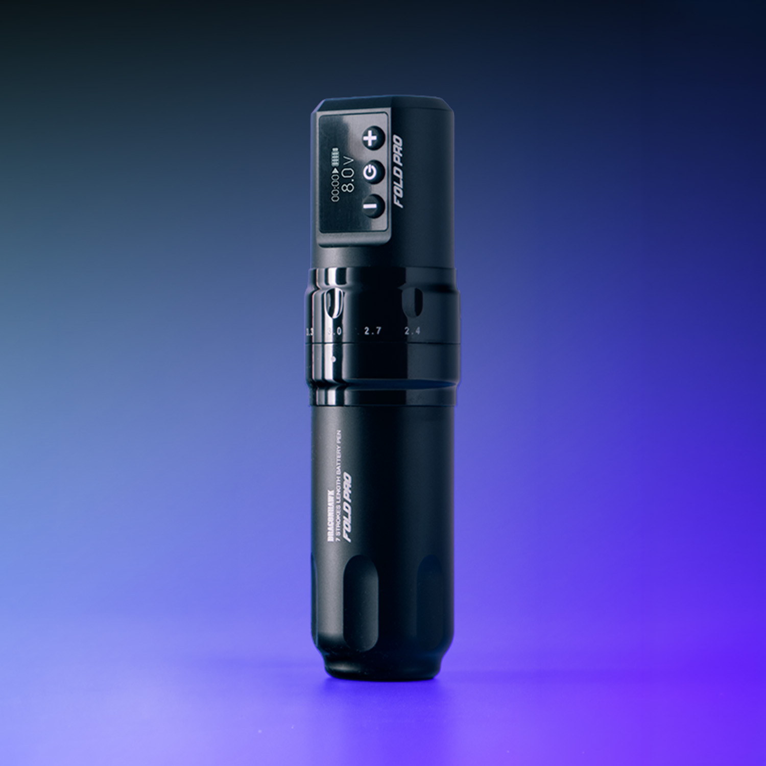 The Dragonhawk Fold Pro tattoo machine with a purple background