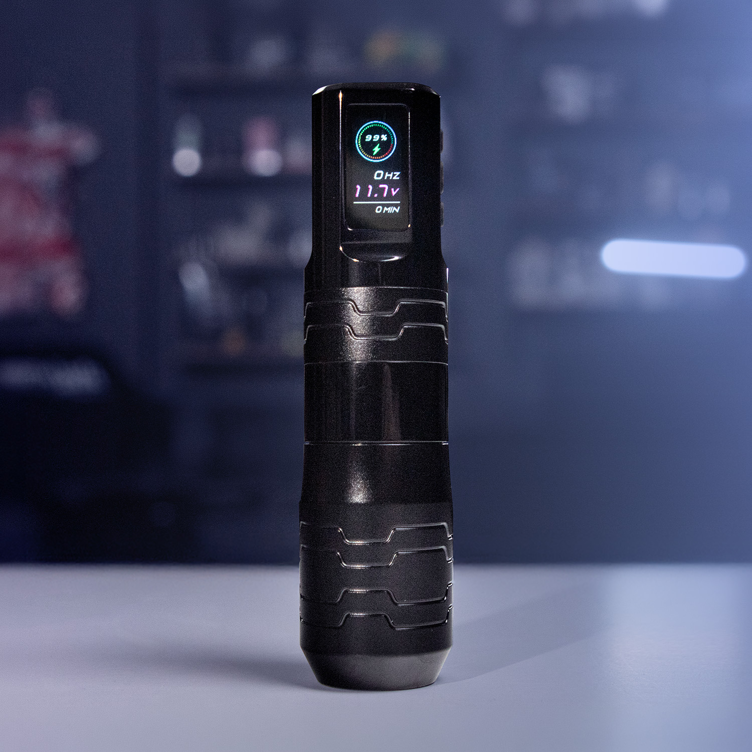 A black tattoo machine with a blurred background